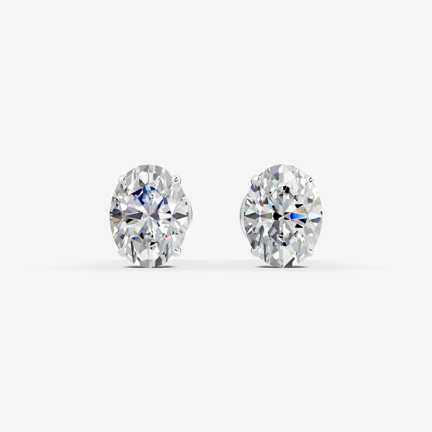 Classic Oval Solitaire Earrings in 18K White Gold