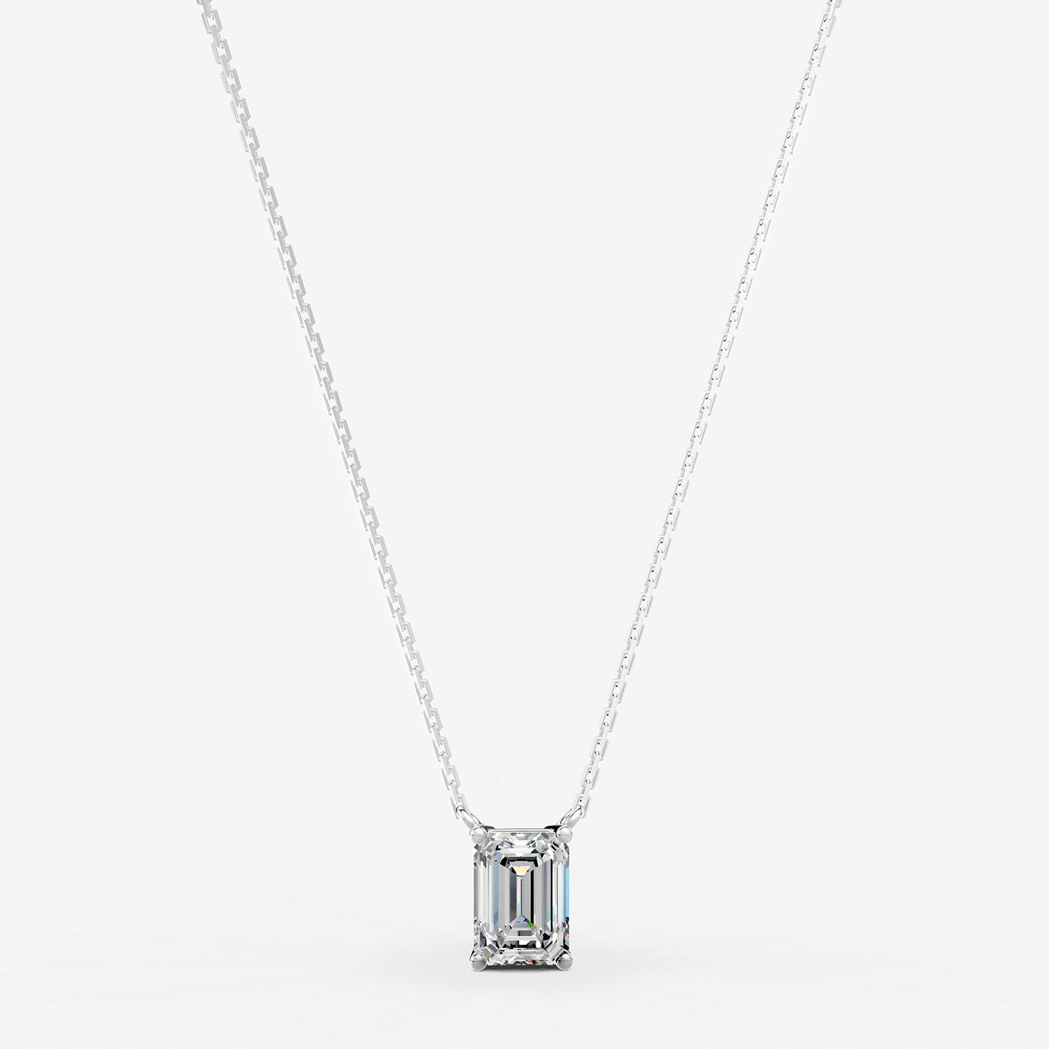 Classic Emerald Solitaire Pendant in 18K White Gold