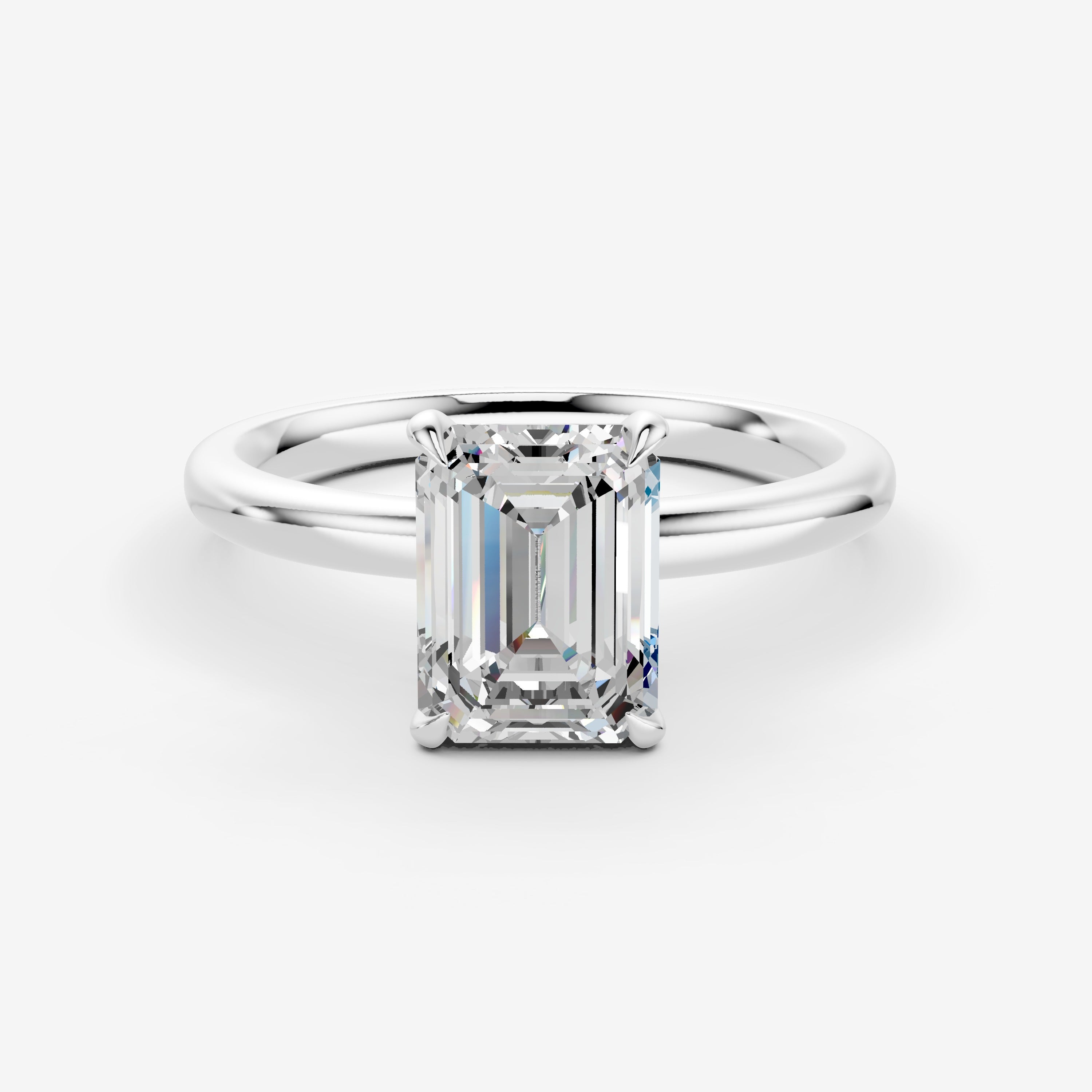 Classic Emerald Solitaire Ring in 18K White Gold