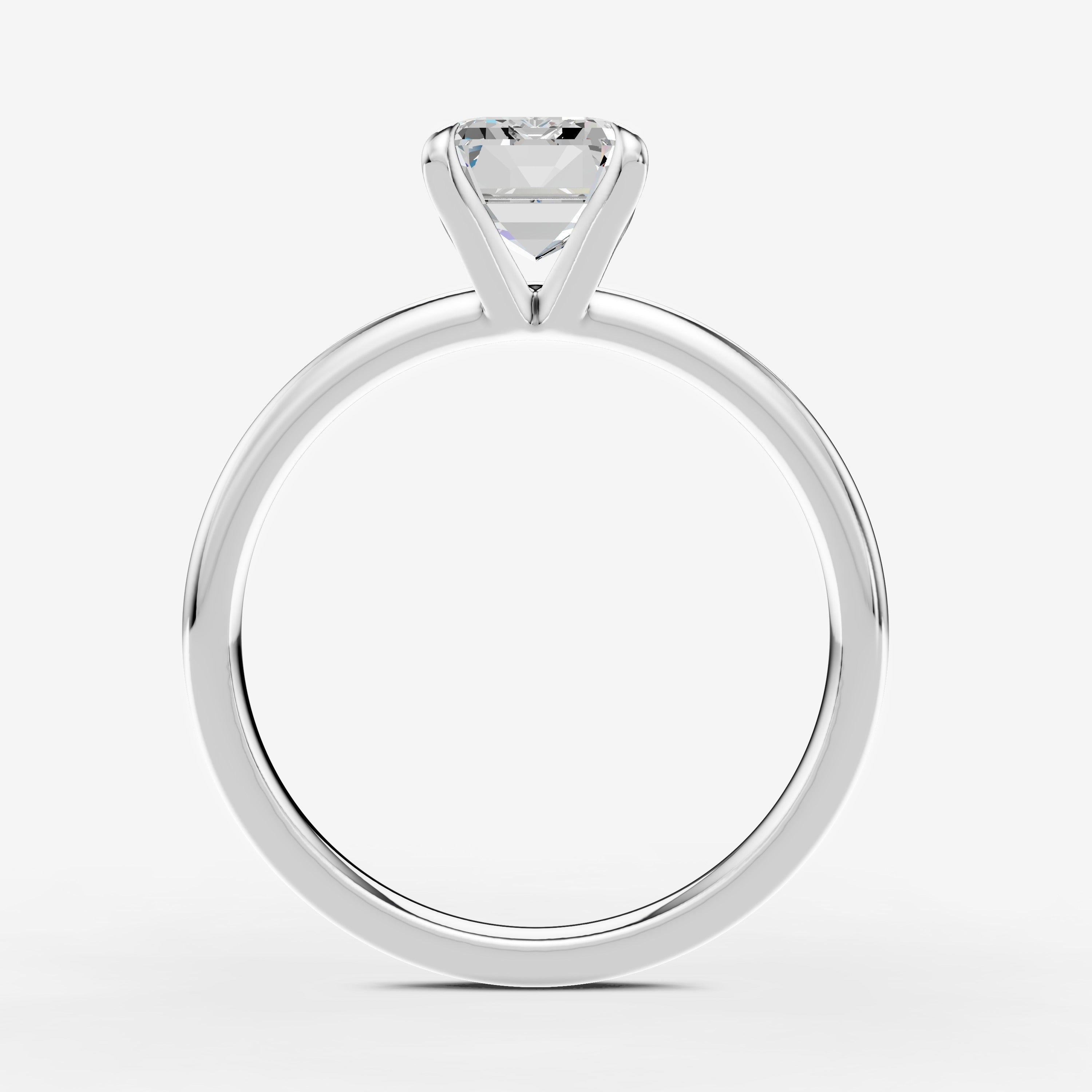 Classic Emerald Solitaire Ring in 18K White Gold